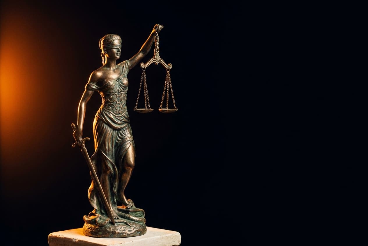 Bronze statue of Lady Justice holding scales